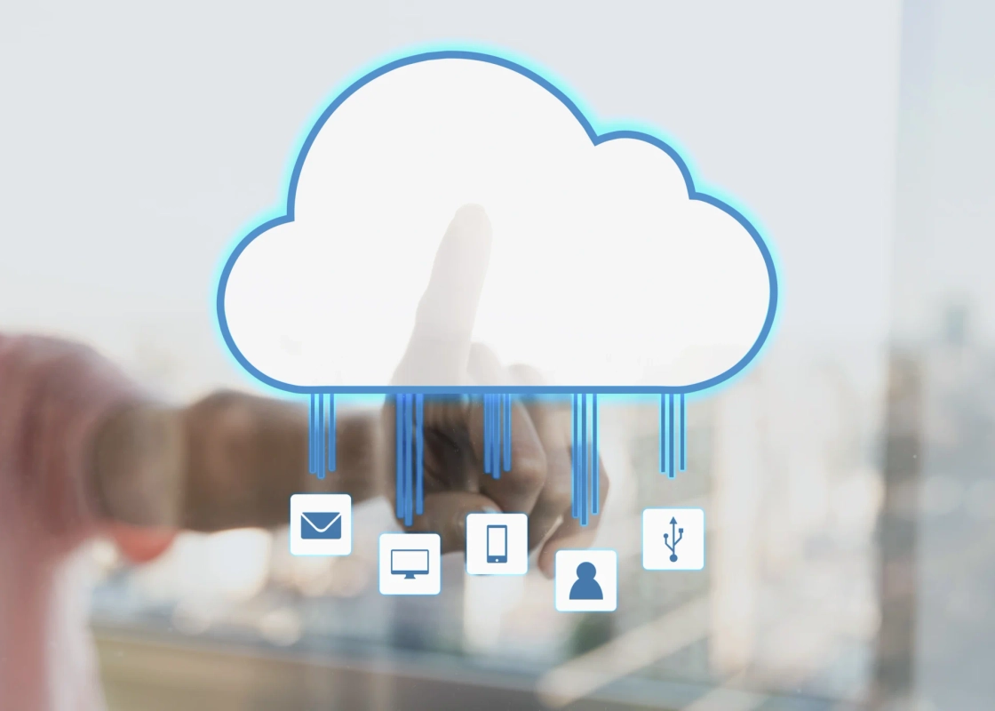 Hand touching a cloud icon connected to devices, representing cloud management